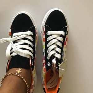 Mudd checker board sneakers run true to size.